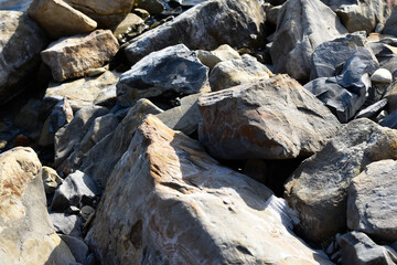Fototapeta na wymiar Huge rocks on the beach. Background, texture.