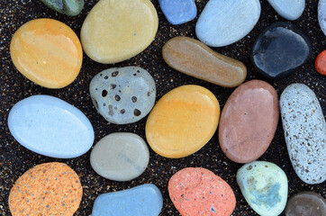 Composition of beautiful beach stones rounded by waves