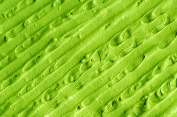 Green cosmetic clay (cucumber facial mask, avocado face cream, green tea matcha body wrap) texture...