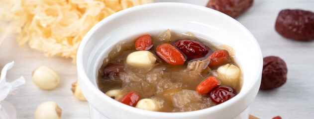 Close up of sweet snow white fungus soup with lotus seed, Chinese red dates and wolfberry.