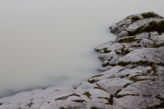 Moody foggy images of a white water lake. Lagarfljot lake, East Iceland.