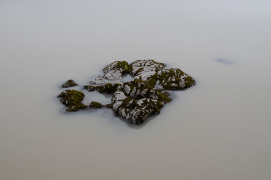 Moody foggy images of a white water lake. Lagarfljot lake, East Iceland. - Powered by Adobe