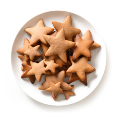 Various homemade Christmas gingerbread cookies as snowflakes, stars, Christmas tree in plate isolated on white background. Xmas treats.