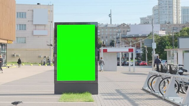  Empty billboard with a green screen for advertising on the city square.