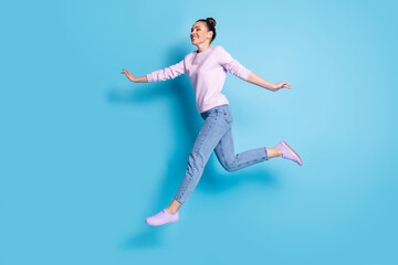 Fototapeta na wymiar Full length body size profile side view her she nice-looking attractive pretty lovely feminine cheerful cheery girl jumping running enjoying isolated bright vivid shine vibrant blue color background