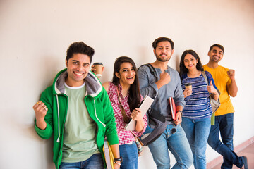 Education is fun - Cheerful Indian asian young students enjoying togetherness in college campus