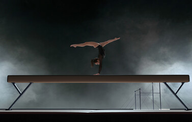 Female gymnast doing a complicated trick in a professional arena.
