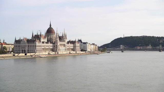 Parliament in Budapest, Hungary. The Chain Bridge and Hills of Buda in the background.