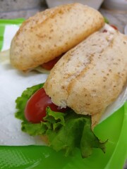 Green burger with domato and salat