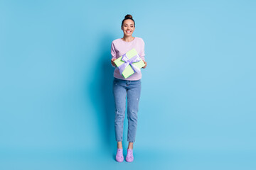 Full length photo of charming cute pretty girl enjoy anniversary celebration holiday hold gift box package wear good look outfit isolated over blue color background