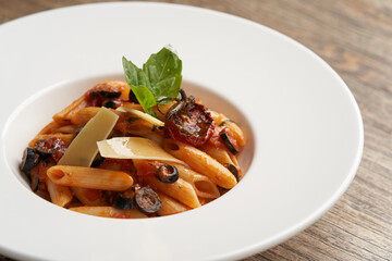Pasta Penne with Tomato, olives and Basil