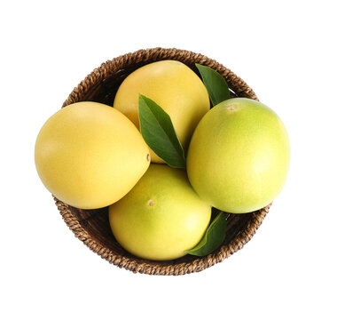 Wicker bowl with delicious pomelos isolated on white, top view