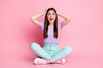 Full size photo of astonished positive girl sit floor legs crossed impressed wonderful bargain...