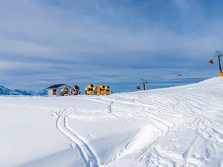 Fotobehang snow making machines on the ski slope © Natalia Gorsha