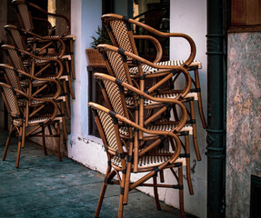Chairs in cafes and restaurants are stacked. Concept: coronavirus lockdown, COVID-19