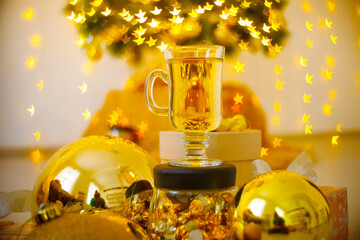 Christmas or New Year hot winter drink, spicy grog cocktail, punch or mulled wine with tea, lemon,...