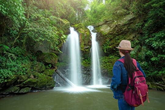 Traveler standing at Sapan Waterfall (Namtok Sapan) 3nd floor is most beautiful waterfall of NAN province. Khun Nan National Park, Sapan village, Boklua District, Nan Province, Thailand