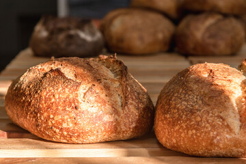 Various rustic bread on a wooden board. Healthy food and farming concept