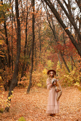 model with a red fox in the autumn forest