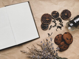 old book, dried flowers and fruit tea leaves