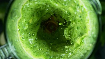 Green fresh smoothie blended in blender, top view. Healthy eating concept. Super slow motion filmed on high speed cinematic camera. - Powered by Adobe