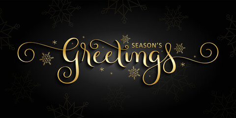 Fototapeta na wymiar SEASON'S GREETINGS gold vector brush calligraphy banner with spiral swashes and snowflakes on black background