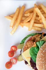A vegan burger with vegetables and tomato

