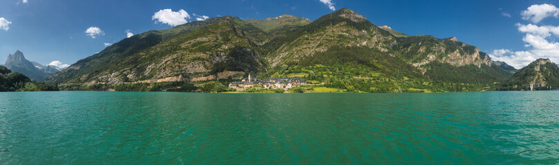 Mountain lake with a village in the background