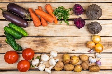 Assortment of fresh vegetables on wood background
