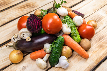 Assortment of fresh vegetables on wood background