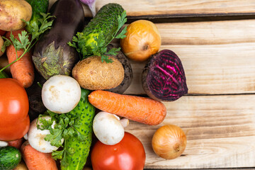 Assortment of fresh vegetables on wood background