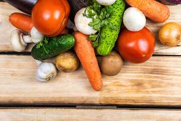 Assortment of fresh vegetables on wood background