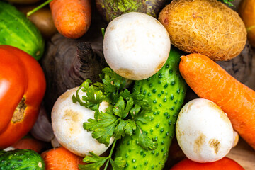 Assortment of fresh vegetables on wood background