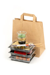 Food delivery concept, sushi in plastic container delivered to home