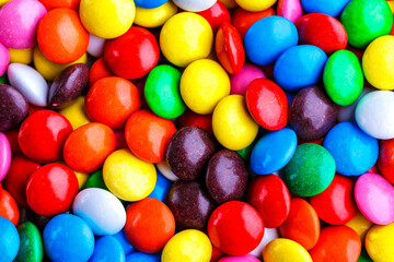 Fototapeta na wymiar Colorful chocolate candy pills.Candy variation color texture or background.Sweet food photo concept.top view