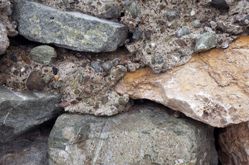 Old broken pier on the coast. Broken concrete.   