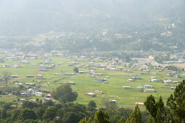 Indian Himalayas, mountain slopes, hillside village, tree houses