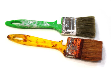 Brushes with yellow and green handles for surface painting