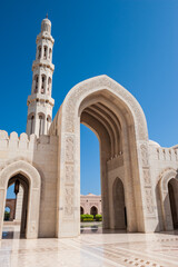 Fototapeta na wymiar Courtyard and Minaret in Sultan Qaboos Grand Mosque, Muscat, Oman