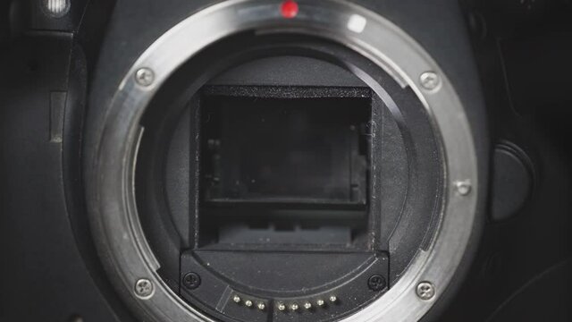 Close up of working camera shutter. Camera shutter blades opening and closing in slow motion