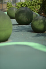Round rocks as decorations outdoors on a small pathway