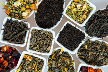 Assortment of dry tea. Various kinds of tea isolated on white.Different kinds of tea leaves. Tea composition with different kind of tea. Tea concept. Tea leaves