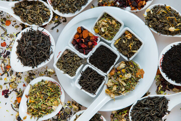 Assortment of dry tea. Various kinds of tea isolated on white.Different kinds of tea leaves. Tea...