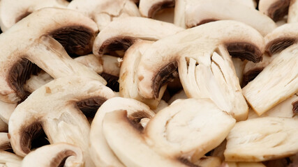 Champignon mushrooms sliced close up