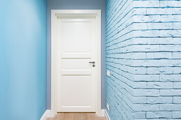 White door in the corridor of the new flat.