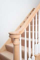 Unfinished, new construction, right hand stair turnout, handrail and primed balusters