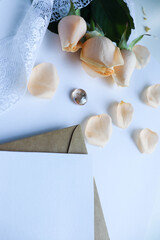 postcard mockup. small bouquet of beige roses on a white background. congratulation. invitation
