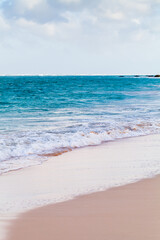Atlantic ocean coast with wet sand and azure ocean