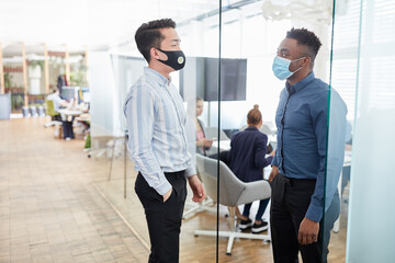 Two young business people with everyday mask