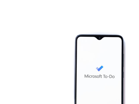 Lod, Israel - July 8, 2020: Microsoft To Do app launch screen with logo on the display of a black mobile smartphone isolated on white background. Top view flat lay with copy space.